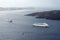 Beautiful landscape with sea views. Cruise ship in sea near NEA Kameni, a small Greek island in the Aegean sea near Santorini.