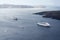 Beautiful landscape with sea views. Cruise ship in sea near NEA Kameni, a small Greek island in the Aegean sea near Santorini.