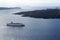 Beautiful landscape with sea views. Cruise ship in sea near NEA Kameni, a small Greek island in the Aegean sea near Santorini.