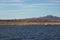 Beautiful landscape. Ship sailing in the sea. Egyptian mountains and the red sea. Light clouds in the blue sky.