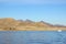 Beautiful landscape. Ship sailing in the sea Egyptian mountains and the red sea. Light clouds in the blue sky.