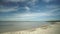 Beautiful landscape with shore, beach, fishing wooden boats and island on a sunny day of Svityaz lake, Ukraine.