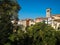 Beautiful landscape shot of Cividale del Friuli with trees in front of historic village and belltower