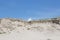 Beautiful Landscape Small White cloud on blue sky background coming from big dune. Curonian Spit