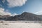 Beautiful Landscape of snowy winter greater Caucasus mountains. Sunny weather, trees clouds fields of Azerbaijan