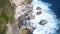 Beautiful landscape of stone cliffs, ocean waves and oceanscape. Aerial top view. Bali, Indonesia.