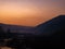 Beautiful landscape stones in mountain lake, reflection, blue sky and yellow sunlight in sunrise. Ukraine. Amazing scene