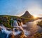 Beautiful landscape with sunrise on Kirkjufellsfoss waterfall and Kirkjufell mountain, Iceland.