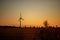 beautiful landscape at sunset. windmill in the field