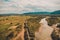 Beautiful landscape from the top shows the river and field in the countryside.