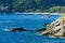 Beautiful Landscape and Tropical over the blue sea and Cape with fishing boat, Yacht or sailboat in the background and rock cape f