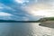 Beautiful landscape with turquoise lake, reflection of blue sky and wild mountains. Relaxing paradise background. Tranquility.