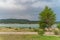 Beautiful landscape with turquoise lake, reflection of blue sky and wild mountains. Relaxing paradise background. Tranquility.