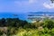 Beautiful landscape of turquoise ocean waves with boats, coastline and blue sky background from high aerial view point