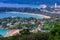 Beautiful landscape of turquoise ocean waves with boats, coastline and blue sky background from high aerial view point