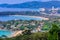 Beautiful landscape of turquoise ocean waves with boats, coastline and blue sky background from high aerial view point