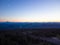 Beautiful landscape. Twilight. Road, lots of cars. Forest, in the distance you can see the mountain range. Tourist, resort place.