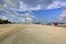 Beautiful landscape view. Coastline, Maldives, Dhangethi. Yellow sand road and blue sly with white clouds