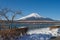 Beautiful landscape view of Fuji mountain or Mt.Fuji covered with white snow in winter seasonal at Yamanaka Lake.
