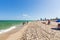 Beautiful landscape view of Miami South  Beach coast line. Sand beach, Atlantic Ocean, people  on blue sky background. USA.