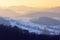 Beautiful landscape view over Odenwald forest with snow at sunset in winter in Germany