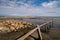 Beautiful landscape view with a pile of irregular rock pieces and a calm lake water