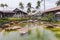 Beautiful landscape view of shopping mall center. Wonderful pond decorated with big rocks on front line. USA.