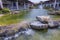 Beautiful landscape view of shopping mall center. Wonderful pond decorated with big rocks on front line. USA.