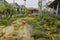 Beautiful landscape view of shopping mall center. Wonderful pond decorated with big rocks on front line. USA.