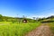 Beautiful landscape view on summer day. Cableway construction slalom ski lift on hill peak on blue sky background. Sweden.