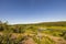 Beautiful landscape view on summer day. Slalom ski lift on hill peak  on blue sky background