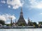 Beautiful landscape with Wat Arun temples in the Chao Phraya river in a summer day