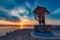 Beautiful landscape of a well with a wheel in the sunrise near the Razelm Lake