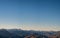 Beautiful landscape of a yellow grassland blue sky and Alps mountain at sunset. I