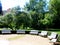 Beautiful landscaped garden full of beautiful blooming flowers and ornamental trees and fountain