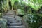 Beautiful landscapes of a green garden with paths, with a staircase and a pond. Sintra, day, Portugal