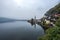 Beautiful landscapes in Hallstatt in a foggy day, a Lakeside Village in dusk, Austria