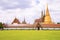 Beautiful landspace picture at Wat Phra Kaew, Temple of the Emerald Buddha against a clouds in the sky and green a lawn
