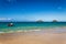 Beautiful Lanikai beach with turquoise water and a motor boat