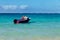 Beautiful Lanikai beach with turquoise water and a motor boat