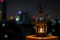 Beautiful Lantern that have moon symbol on top with city bokeh light on dark background