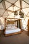 Beautiful large rustic tent with queen size bed in nature