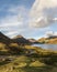 Beautiful late Summer landscape image of Wasdale Valley in Lake District, looking towards Scafell Pike, Great Gable and Kirk Fell