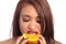 Beautiful Latina Woman Eating an Orange