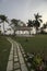 Beautiful lawn with sitting area and decorated pavement at bright day light with selective focus