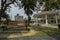 Beautiful lawn with sitting area and decorated pavement at bright day light with selective focus