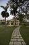 Beautiful lawn with sitting area and decorated pavement at bright day light with selective focus