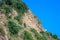 Beautiful layered cliffs on a background of blue sea