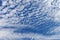Beautiful layered cumulus clouds on a blue sky background. Stratocumulus clouds
