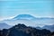 Beautiful layers of misty mountains with Mt. St. Helens in the distance and Eagle Peak in the foreground as seen from Mt. Rainier